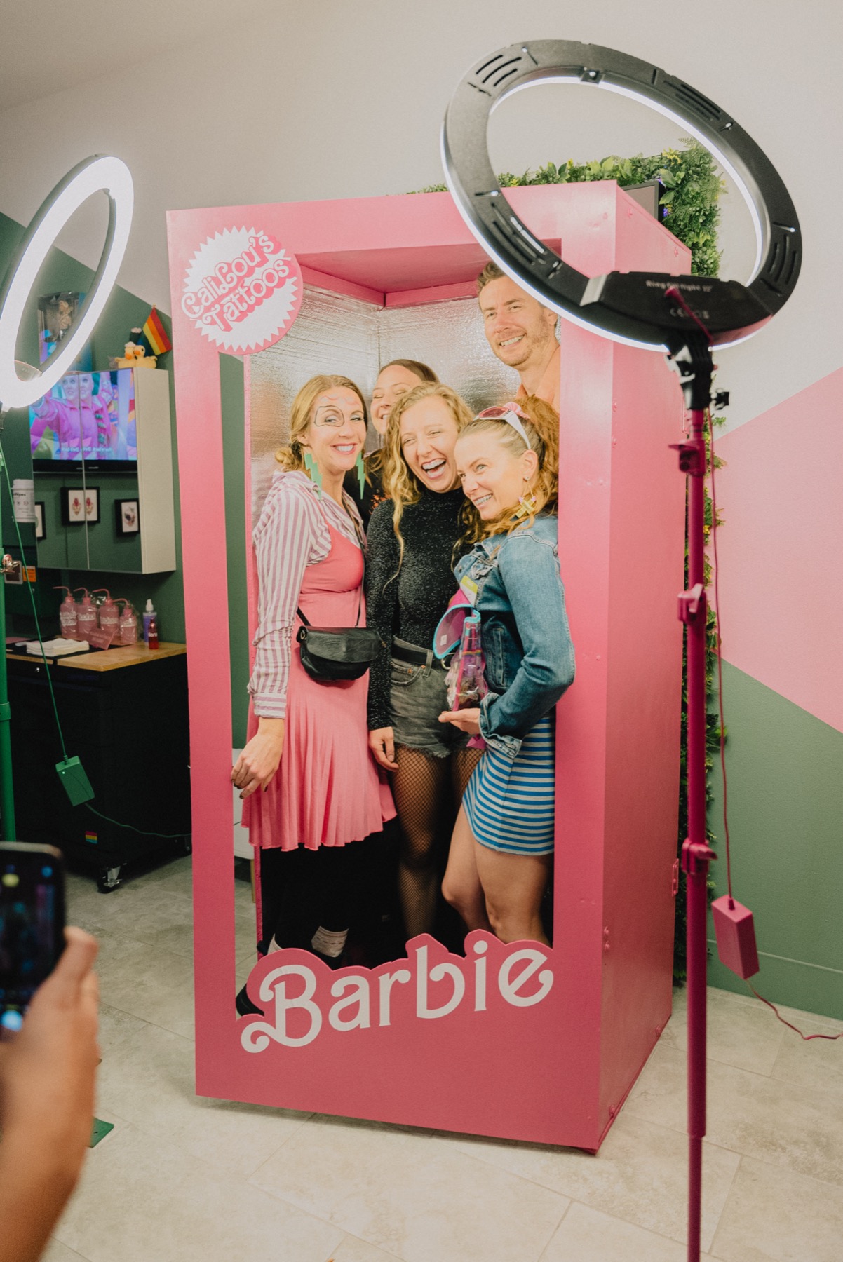 Guests inside the Callous Tattoo Studio Barbie-inspired photo booth