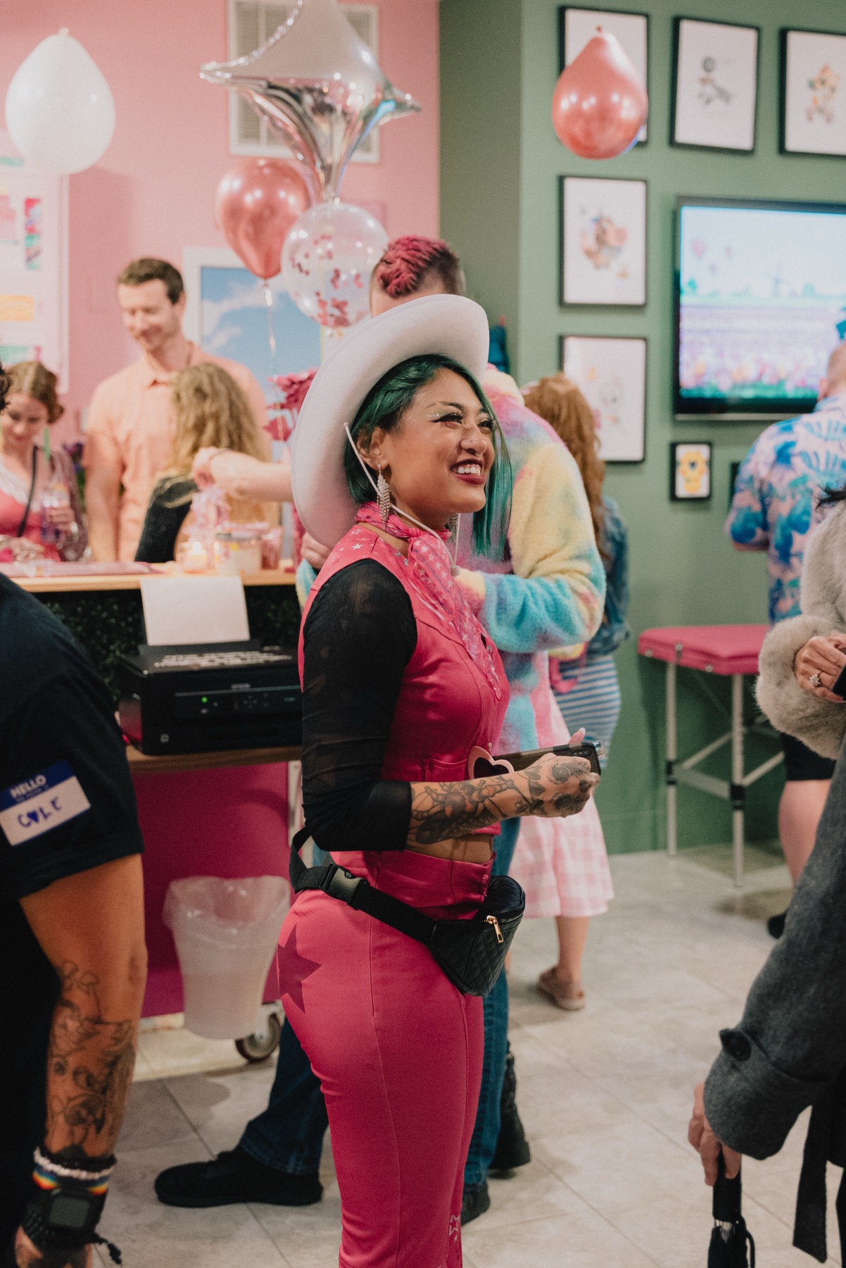Guest in pink at the Callous Tattoo Studio grand opening