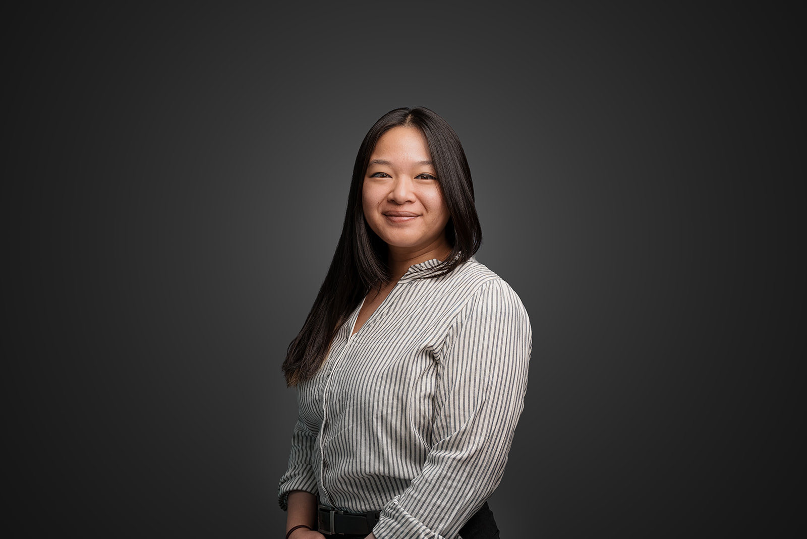 Professional Cintas employee headshot against a dark gray background