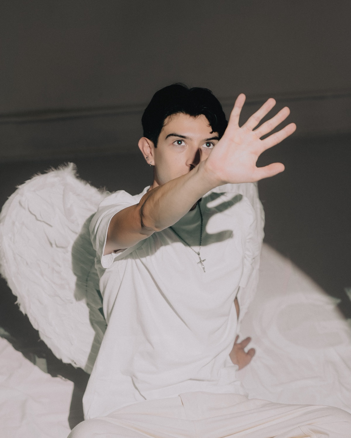 Portrait of Edgar Gator Agent with angel wings in a studio setting