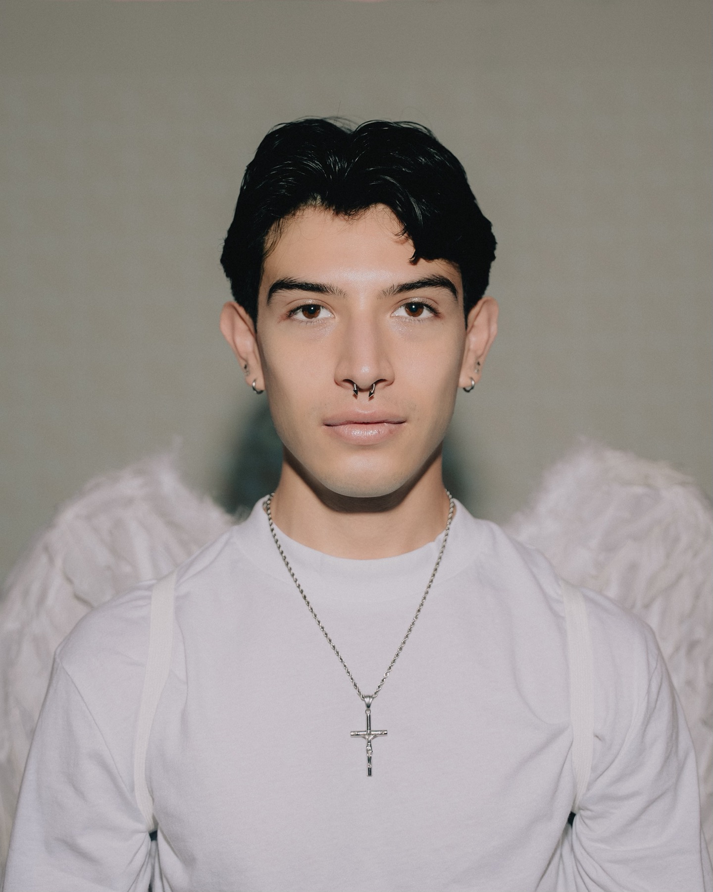 Portrait of Edgar Gator Agent with angel wings and projected imagery